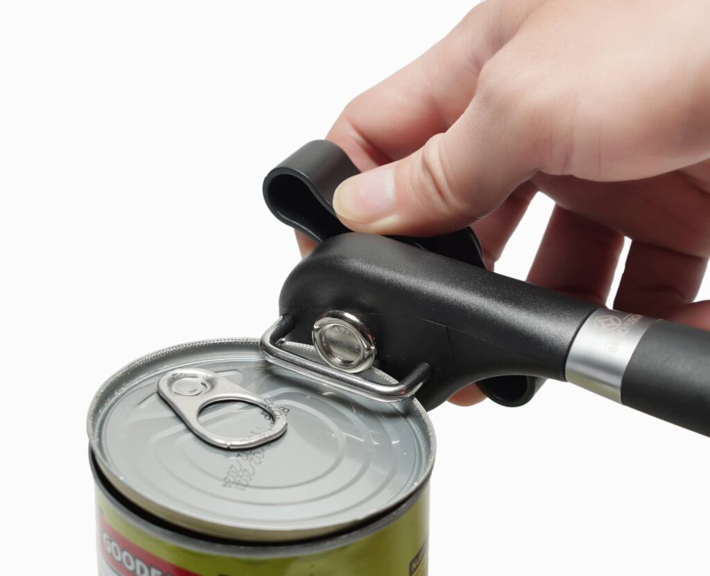 Man's opening the can with Benchusch Covera Smooth Edge Can Opener
