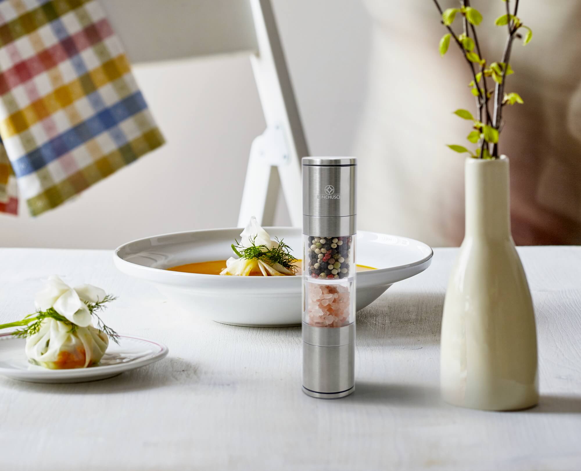 Benchusch Compact 2 in 1 Salt and Pepper Grinder on the dinning table with the orther food